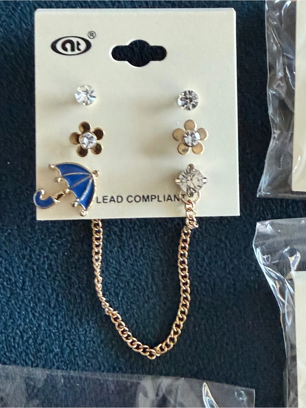 4 sets of earrings in Gold Floral and Umbrella Earring - Pink/Blue/green/ Orange